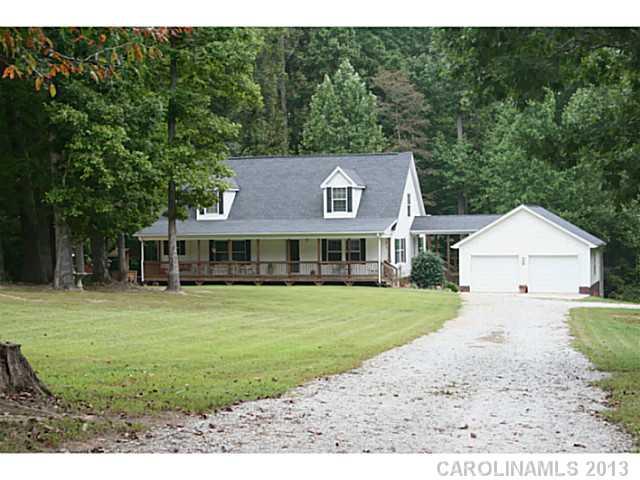 17300 Cool Springs Road Cleveland, NC 27013 - Photo 1 of 14 a view of a big house with a big yard potted plants and large tree