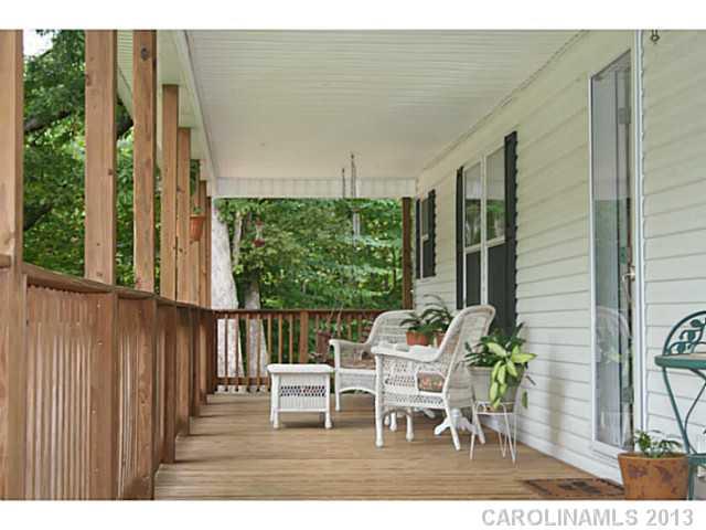 17300 Cool Springs Road Cleveland, NC 27013 - Photo 2 of 14 a view of a chairs and table in the balcony