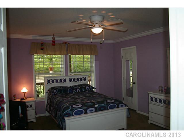 17300 Cool Springs Road Cleveland, NC 27013 - Photo 12 of 14 a bedroom with furniture and a large window