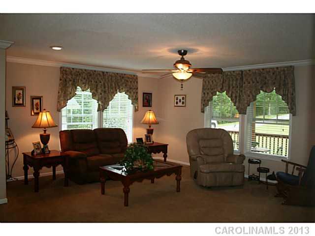 17300 Cool Springs Road Cleveland, NC 27013 - Photo 3 of 14 a living room with furniture and a window