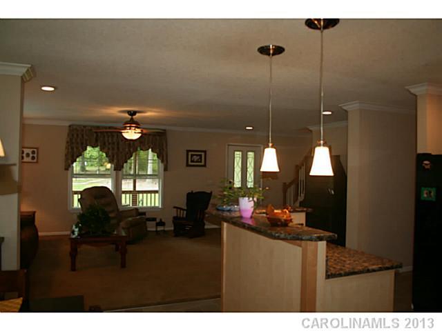 17300 Cool Springs Road Cleveland, NC 27013 - Photo 9 of 14 a living room with furniture and a flat screen tv
