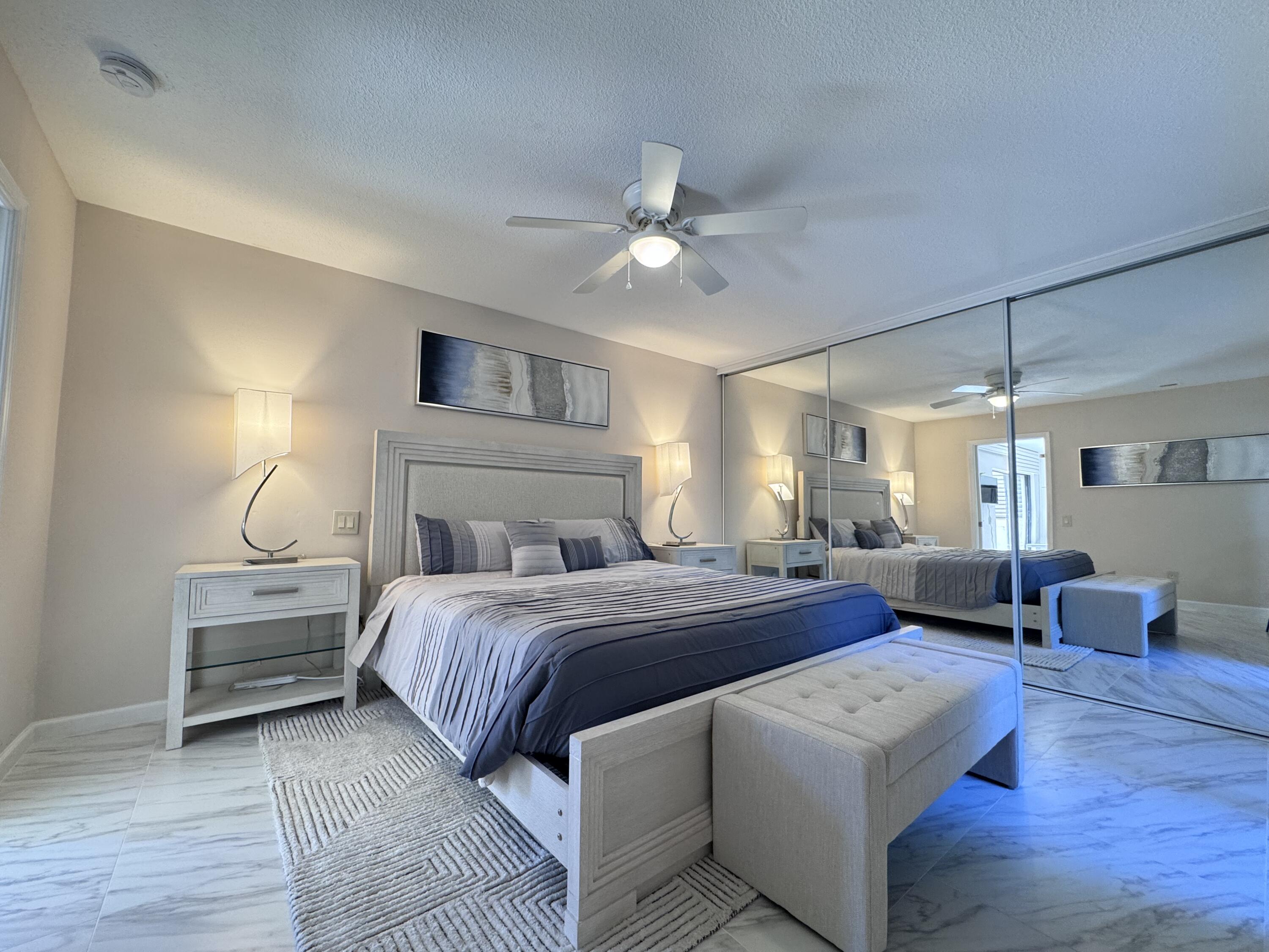 1605 Highway 1, Unit 1A Jupiter, FL 33477 - Photo 9 of 23 a bedroom with bed and window