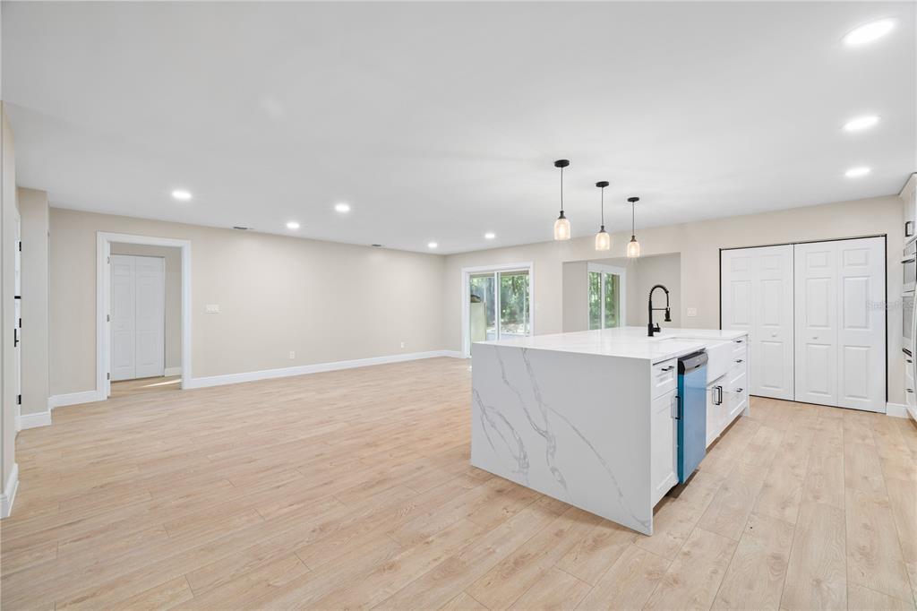 20045 Southwest 88th Place Road Dunnellon, FL 34431 - Photo 14 of 53 a view of kitchen with kitchen island with wooden floor