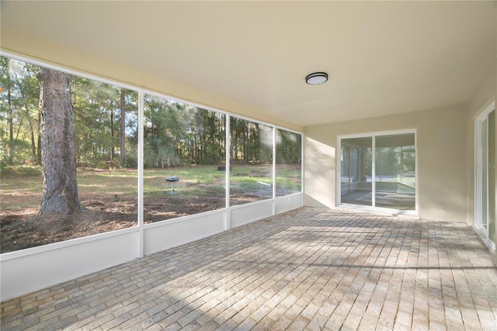 20045 Southwest 88th Place Road Dunnellon, FL 34431 - Photo 20 of 53 a view of empty room with wooden floor and fan
