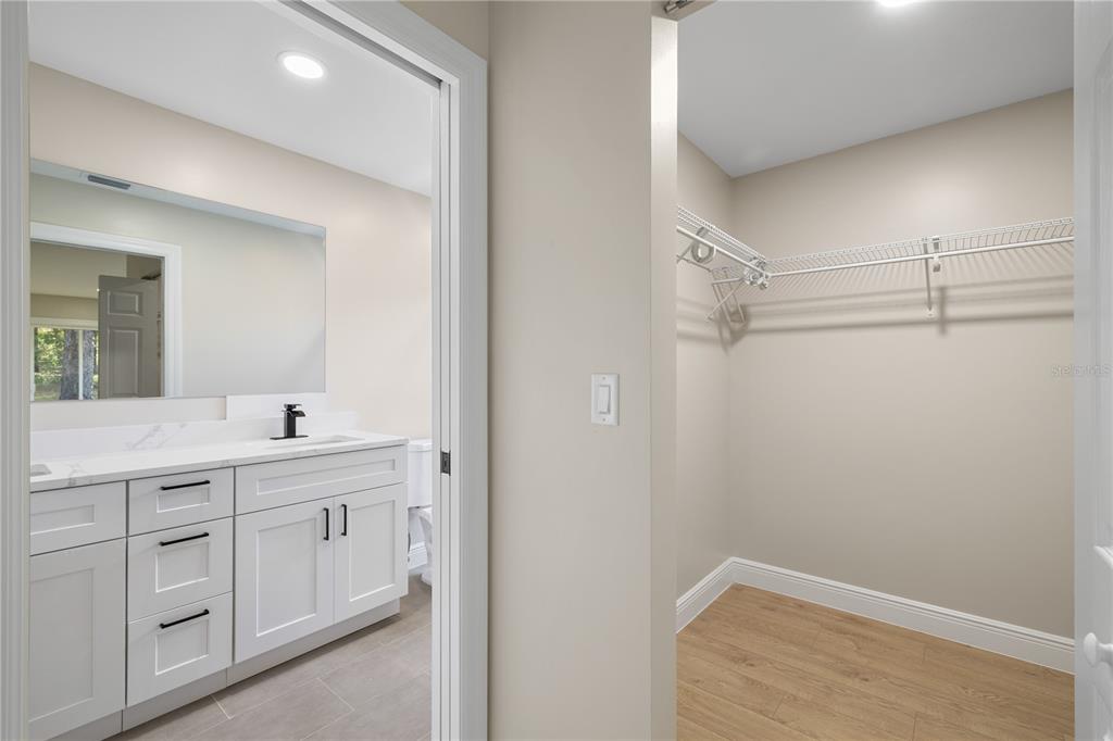 20045 Southwest 88th Place Road Dunnellon, FL 34431 - Photo 23 of 53 a bathroom with a sink a vanity and a mirror