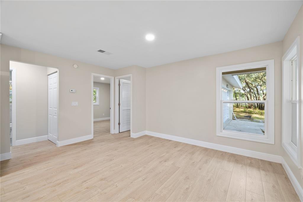20045 Southwest 88th Place Road Dunnellon, FL 34431 - Photo 27 of 53 a view of an empty room with a window