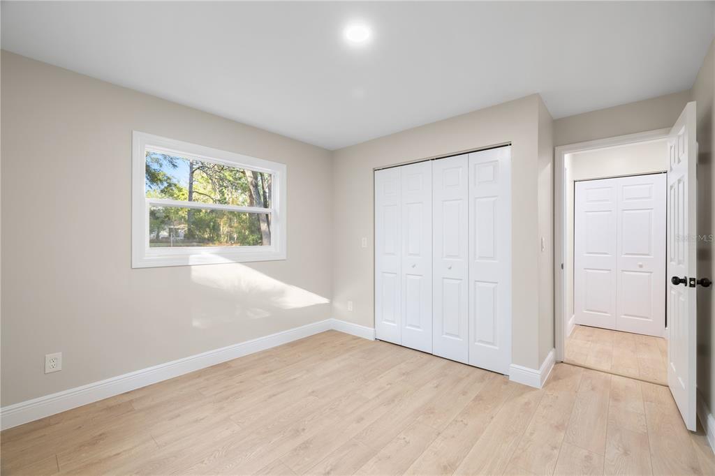 20045 Southwest 88th Place Road Dunnellon, FL 34431 - Photo 30 of 53 an empty room with windows and closet