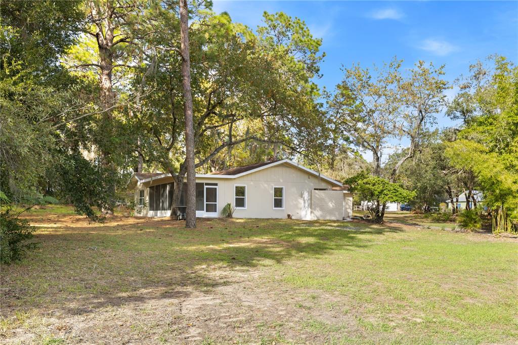 20045 Southwest 88th Place Road Dunnellon, FL 34431 - Photo 42 of 53 a view of a house with a yard