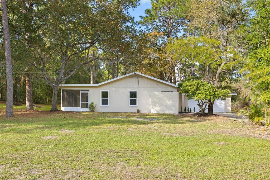 20045 Southwest 88th Place Road Dunnellon, FL 34431 - Photo 44 of 53 a view of a house with a yard