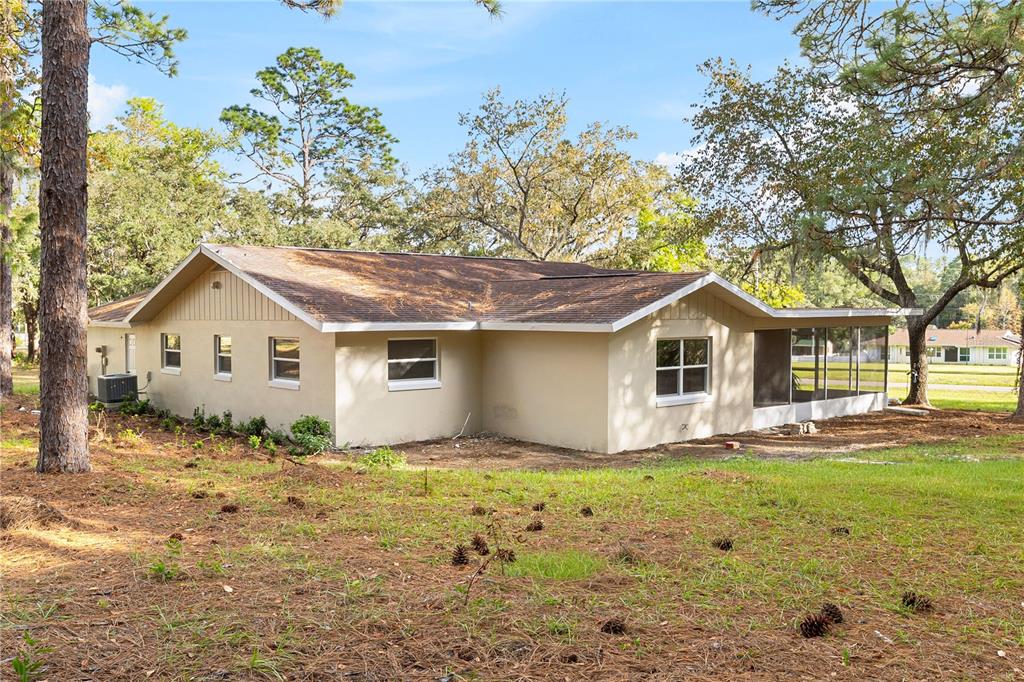 20045 Southwest 88th Place Road Dunnellon, FL 34431 - Photo 48 of 53 a front view of a house with a yard