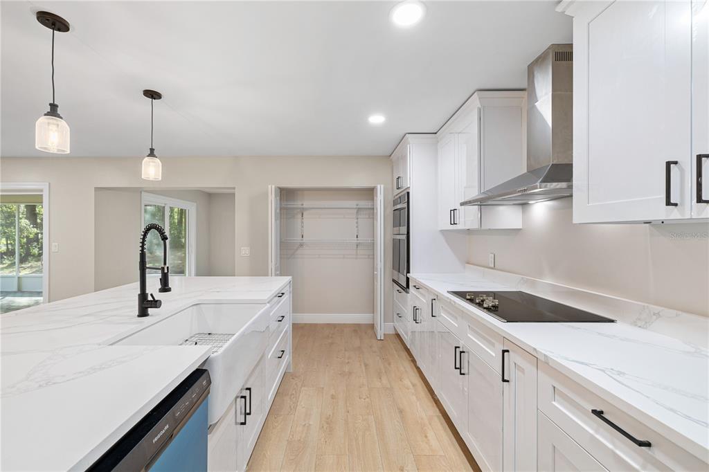 20045 Southwest 88th Place Road Dunnellon, FL 34431 - Photo 10 of 53 a kitchen with a sink stove and cabinets