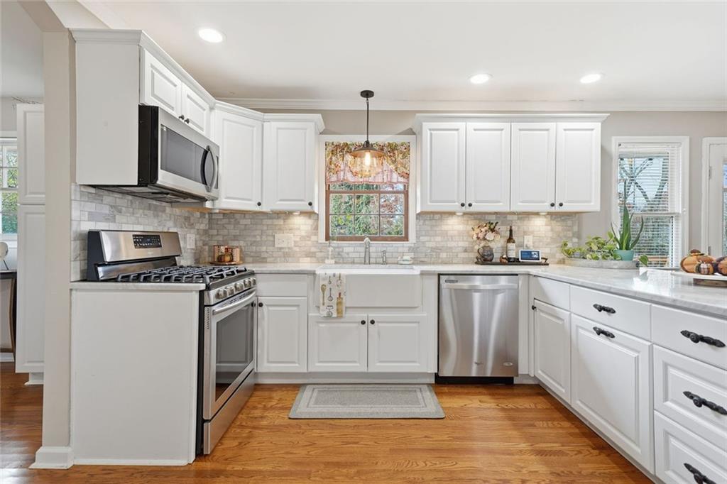 438 Mountainview Circle Canton, GA 30115 - Photo 15 of 41 a kitchen with stainless steel appliances granite countertop a stove a sink and a refrigerator