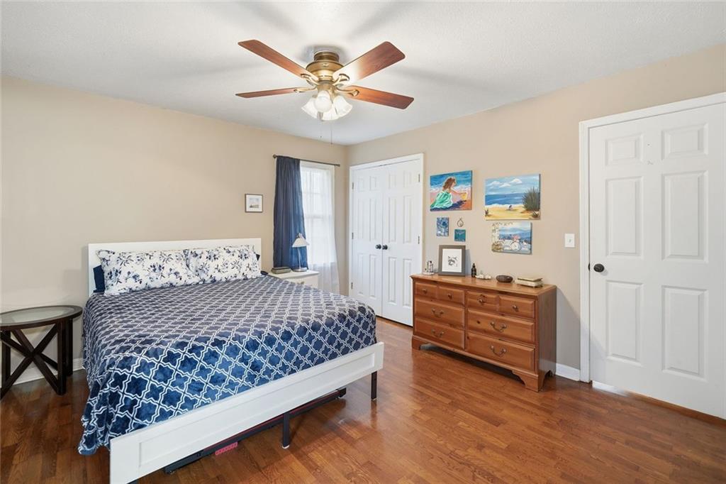 438 Mountainview Circle Canton, GA 30115 - Photo 21 of 41 a bedroom with a bed and a chandelier