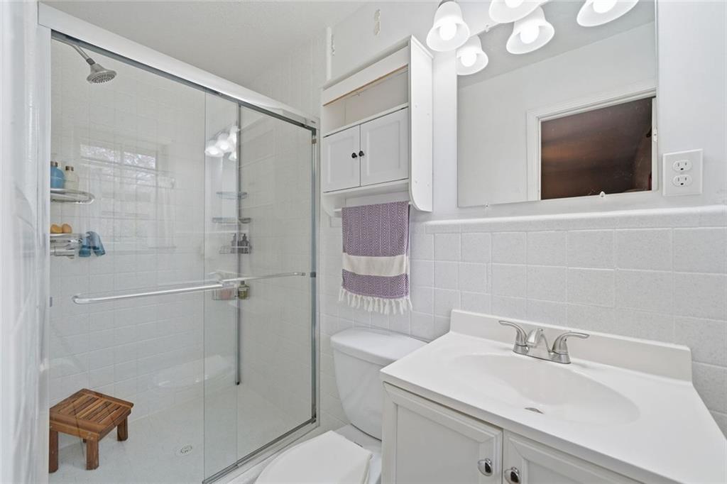 438 Mountainview Circle Canton, GA 30115 - Photo 23 of 41 a bathroom with a sink a toilet and shower