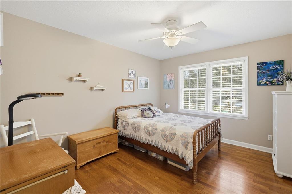 438 Mountainview Circle Canton, GA 30115 - Photo 24 of 41 a bed sitting in a bedroom next to a window