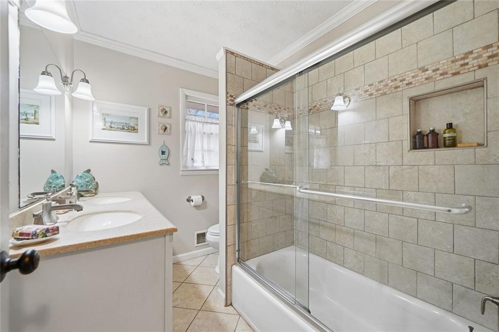 438 Mountainview Circle Canton, GA 30115 - Photo 25 of 41 a bathroom with a sink mirror and a bathtub