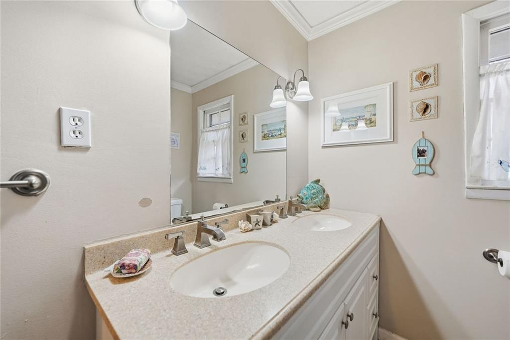 438 Mountainview Circle Canton, GA 30115 - Photo 26 of 41 a bathroom with a sink and a mirror