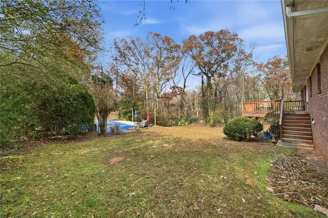 a view of a yard with trees