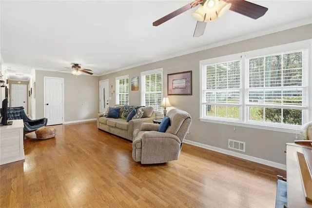 a large bedroom with a bed and furniture