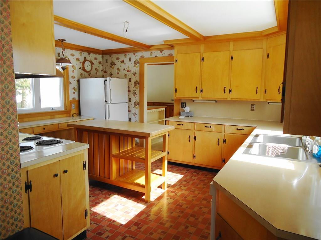 Original cabinetry, wood trim, and...