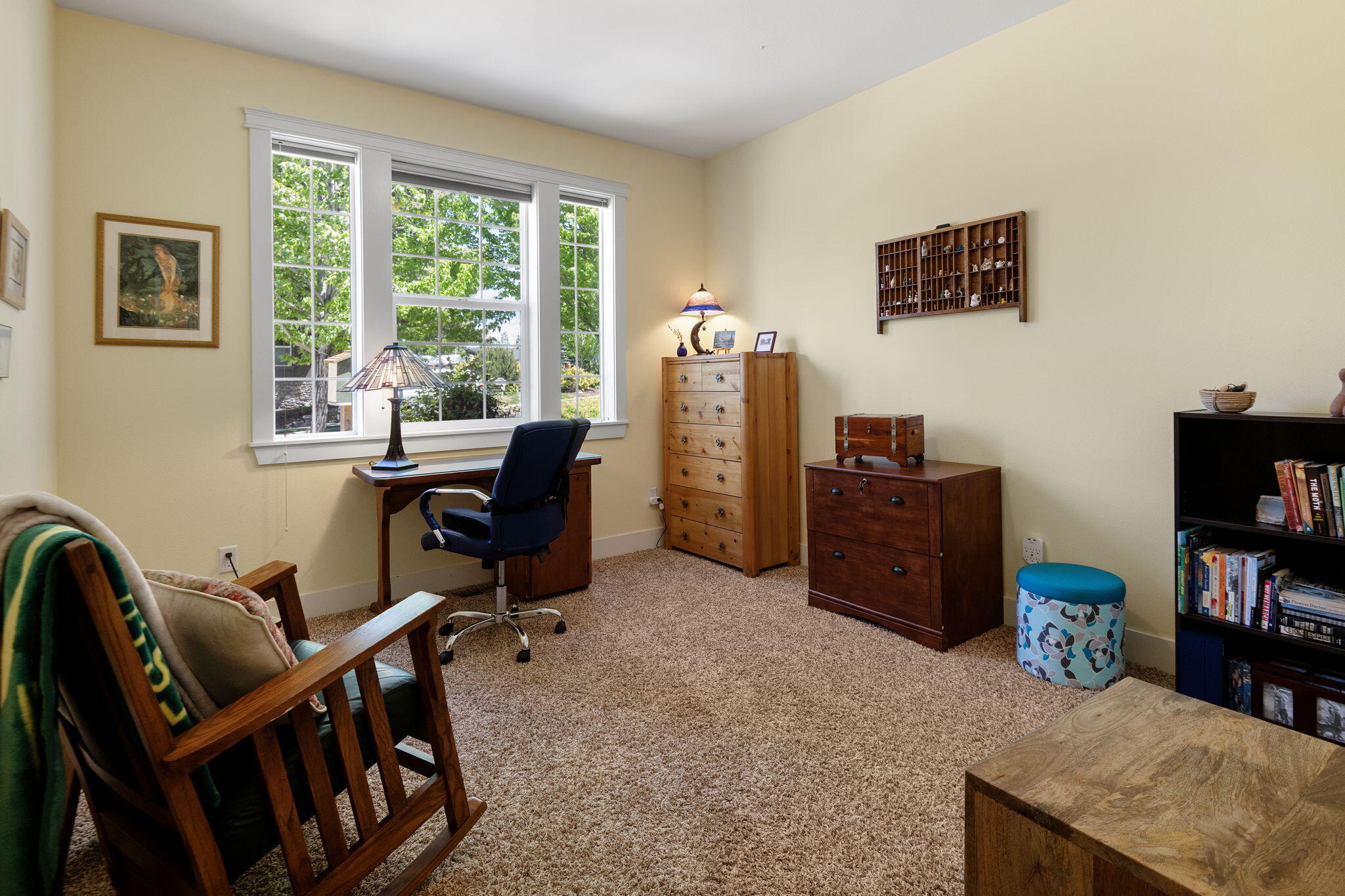 62944 Fresca Street Bend, OR 97703 - Photo 8 of 32 a view of a workspace with furniture and a window