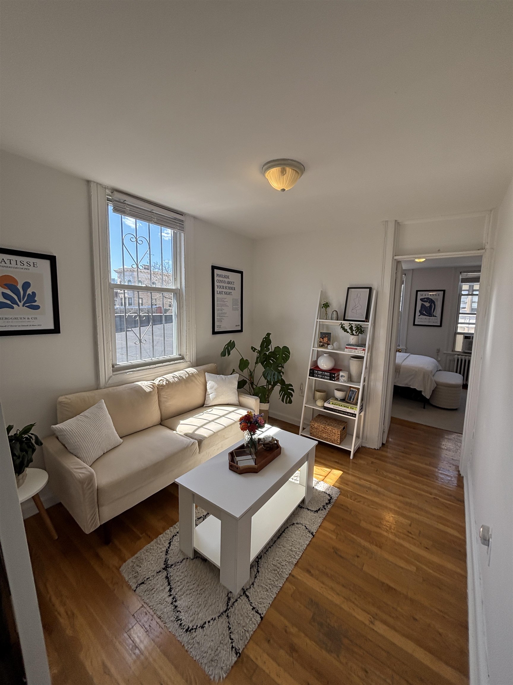 409 Bloomfield Street, Unit 8 Hoboken, NJ 07030 - Photo 1 of 5 a living room with furniture and a wooden floor
