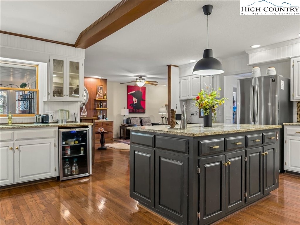 438 Glade Valley Road Glade Valley, NC 28627 - Photo 6 of 50 a kitchen with stainless steel appliances granite countertop a sink a stove and a wooden floors