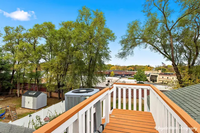 a view of a balcony with wooden floor and outdoor space