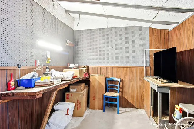 a room with furniture and a flat screen tv