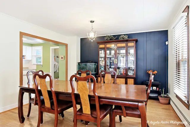 a dining room with furniture and window
