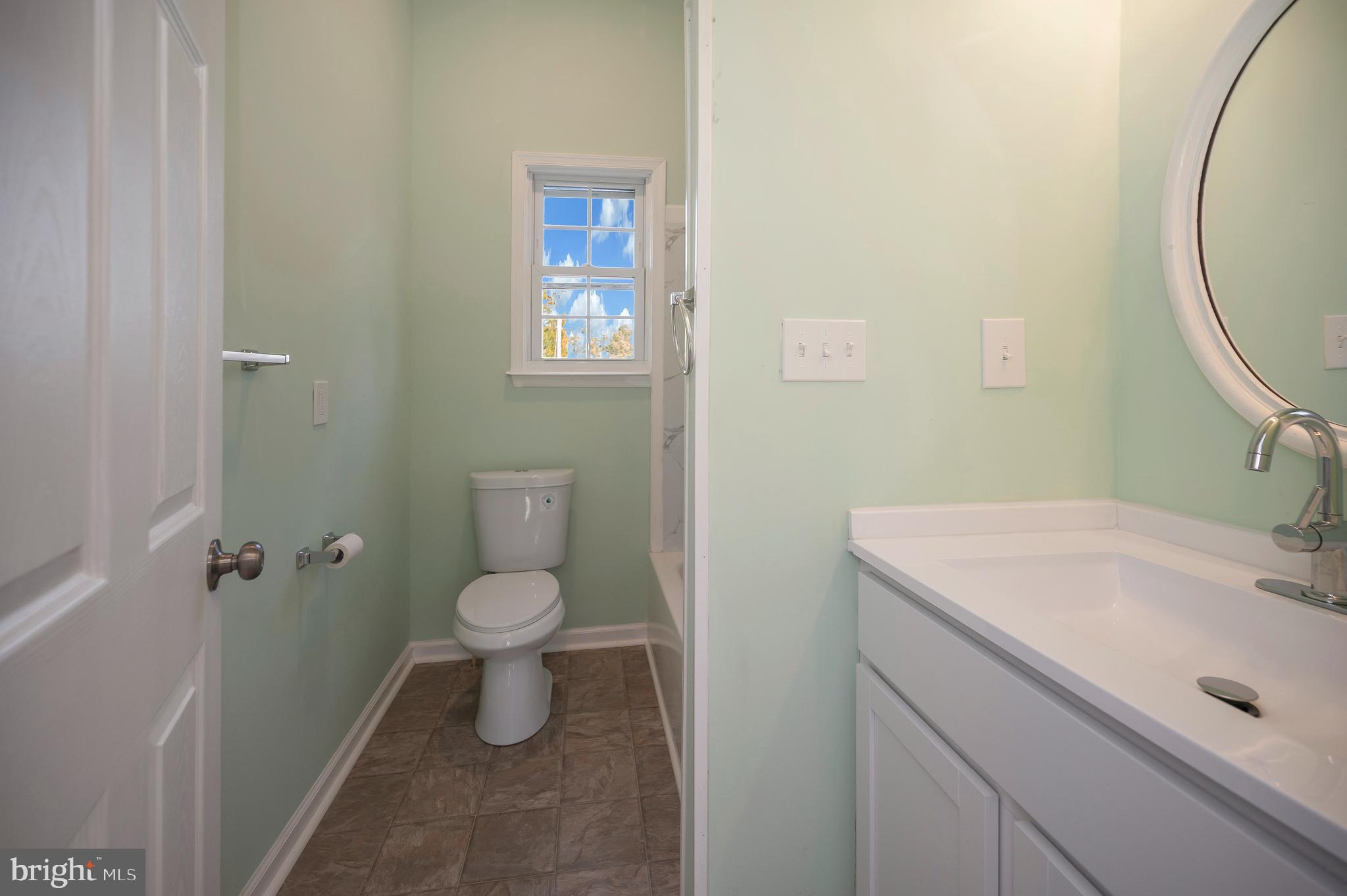 26348 Sunshine Road Ruther Glen, VA 22546 - Photo 11 of 56 a bathroom with a sink a toilet and a mirror