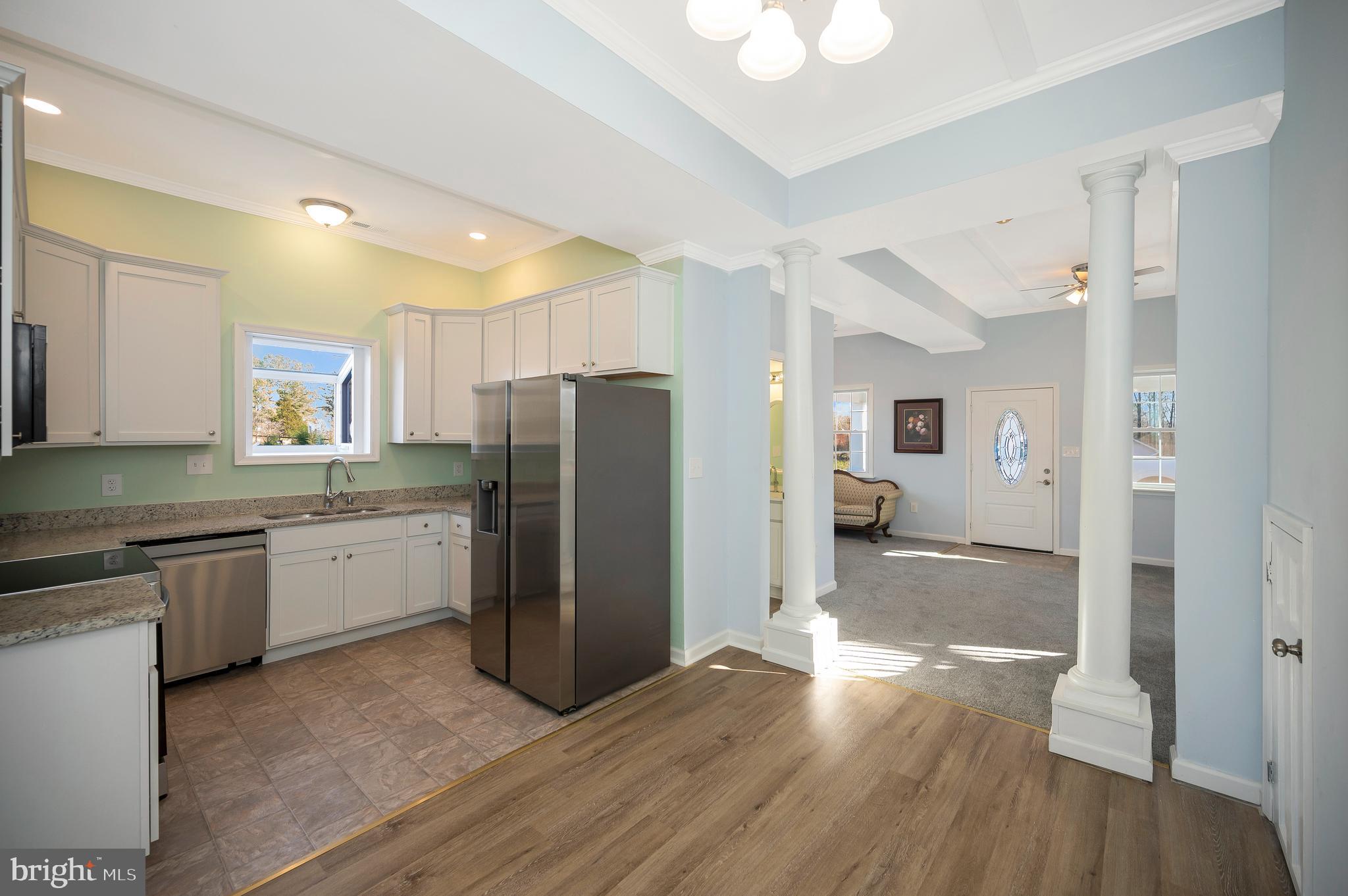 26348 Sunshine Road Ruther Glen, VA 22546 - Photo 15 of 56 a kitchen with granite countertop a refrigerator and a sink