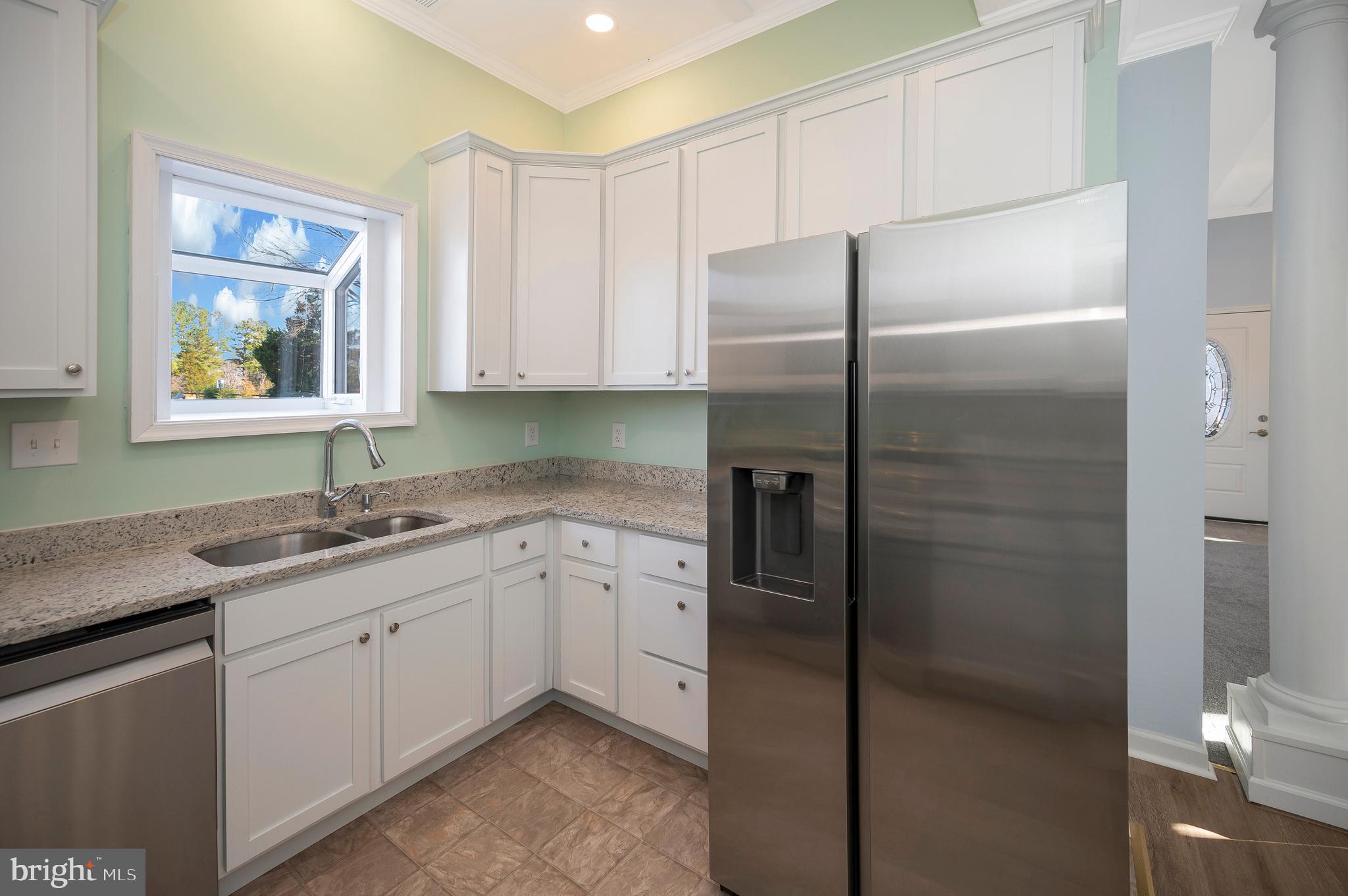 26348 Sunshine Road Ruther Glen, VA 22546 - Photo 20 of 56 a kitchen with a sink stainless steel appliances and cabinets