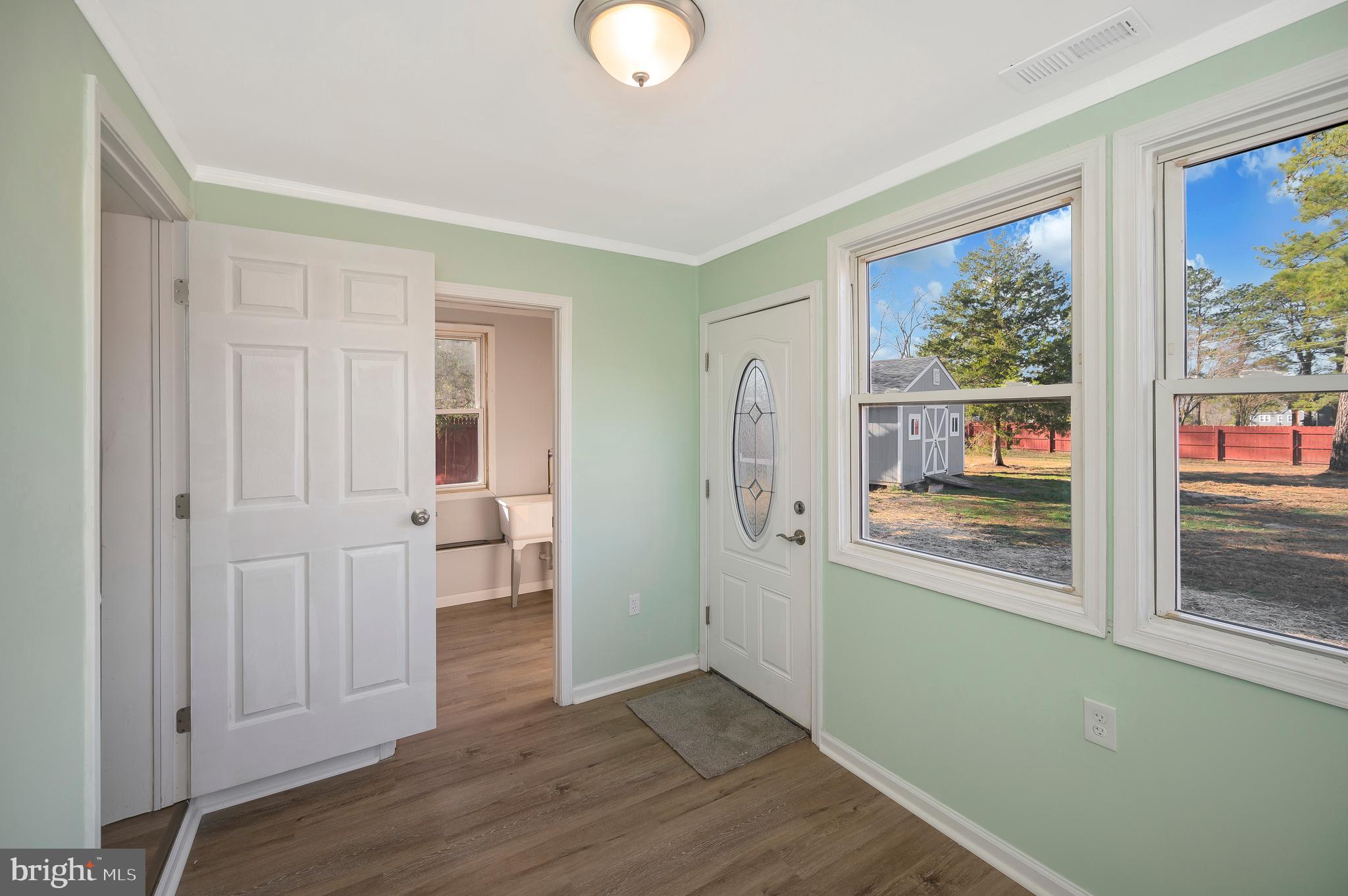 26348 Sunshine Road Ruther Glen, VA 22546 - Photo 25 of 56 a view of empty room with wooden floor and fan