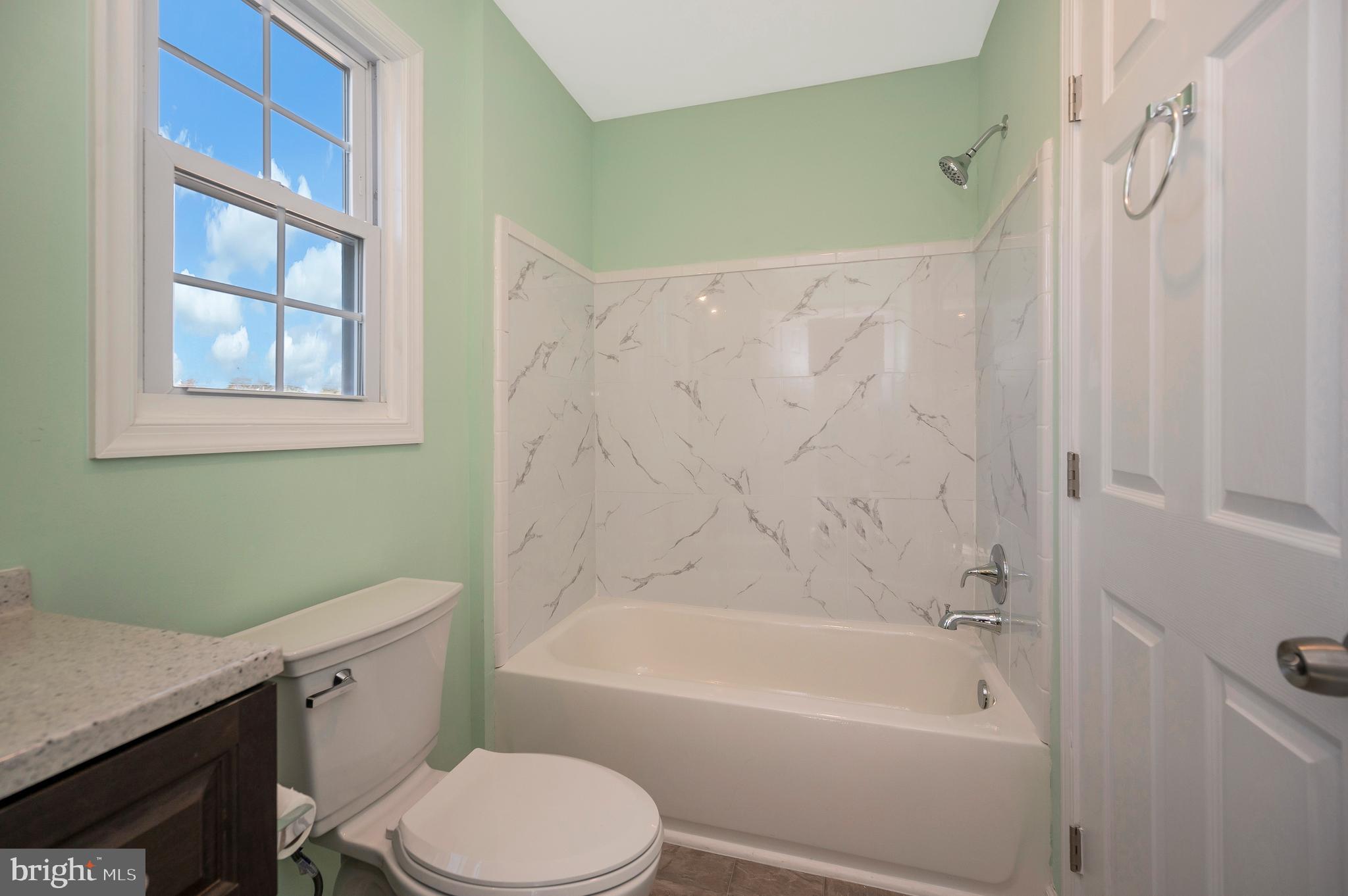 26348 Sunshine Road Ruther Glen, VA 22546 - Photo 31 of 56 a bathroom with a sink toilet and bathtub