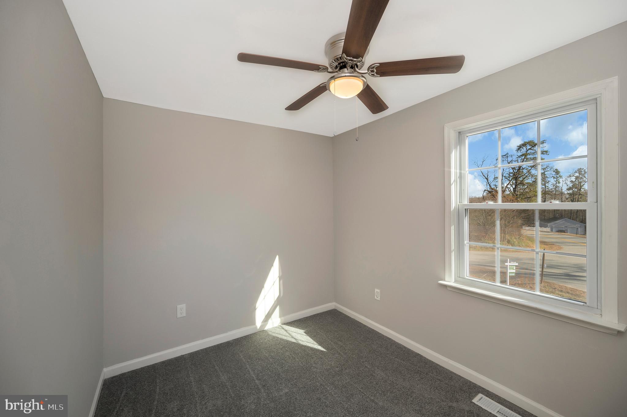 26348 Sunshine Road Ruther Glen, VA 22546 - Photo 37 of 56 a view of an empty room with a window