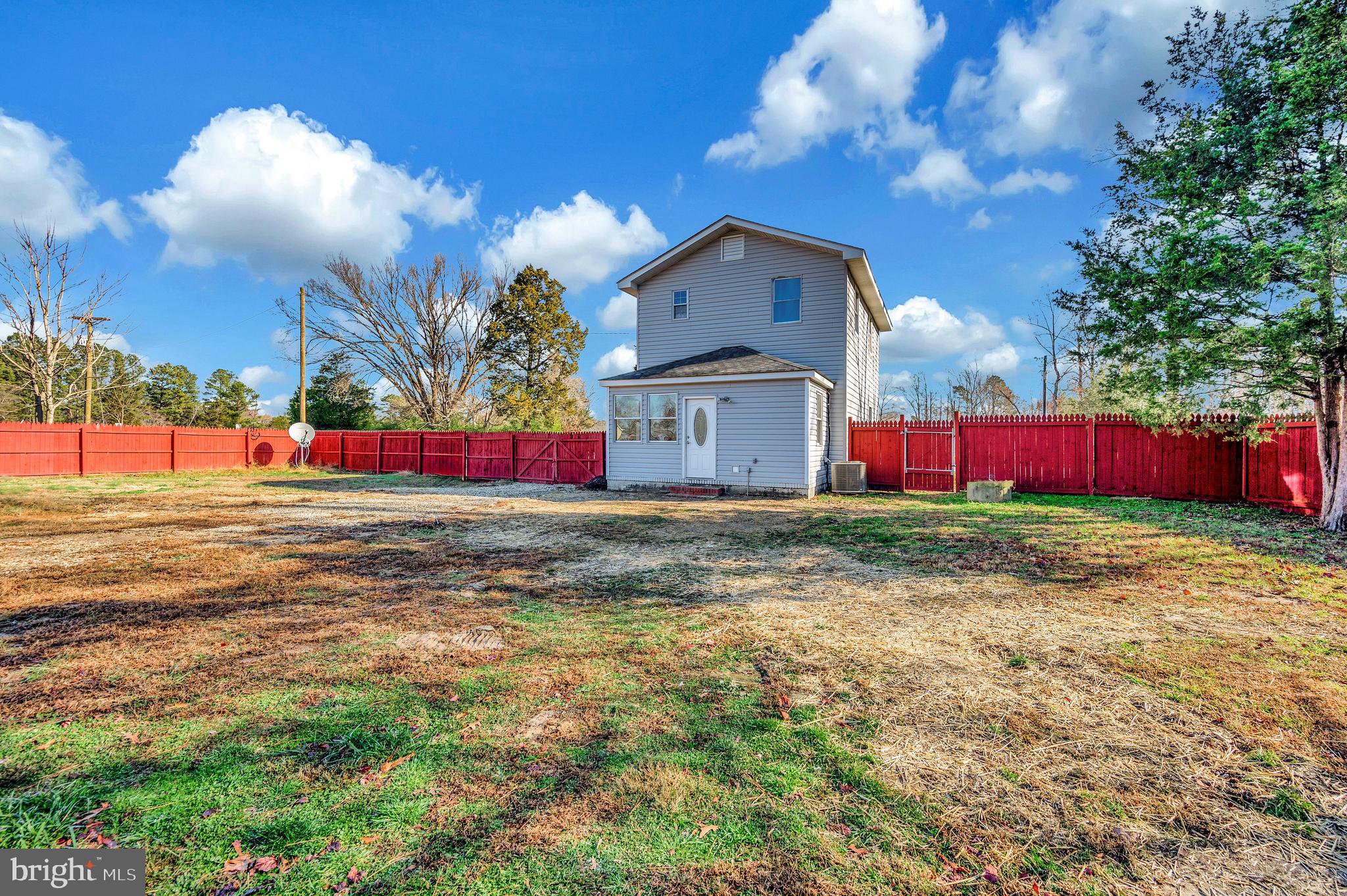 26348 Sunshine Road Ruther Glen, VA 22546 - Photo 43 of 56 a view of backyard of red house