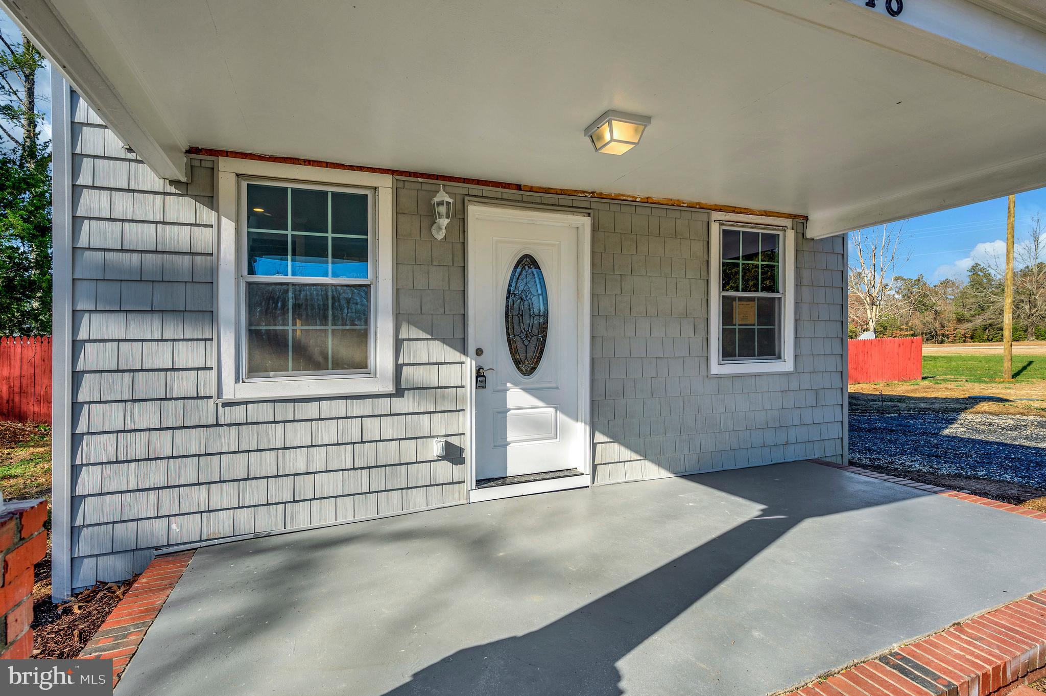 26348 Sunshine Road Ruther Glen, VA 22546 - Photo 53 of 56 a view of a house with a porch