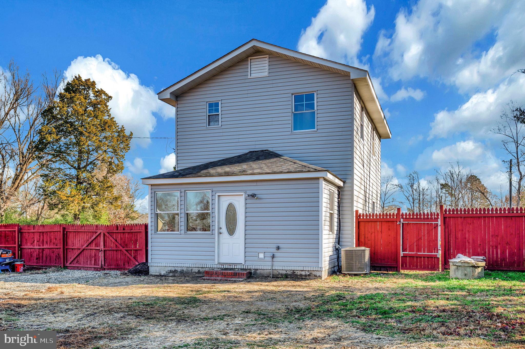 26348 Sunshine Road Ruther Glen, VA 22546 - Photo 55 of 56 a front view of house with yard and trees in the background