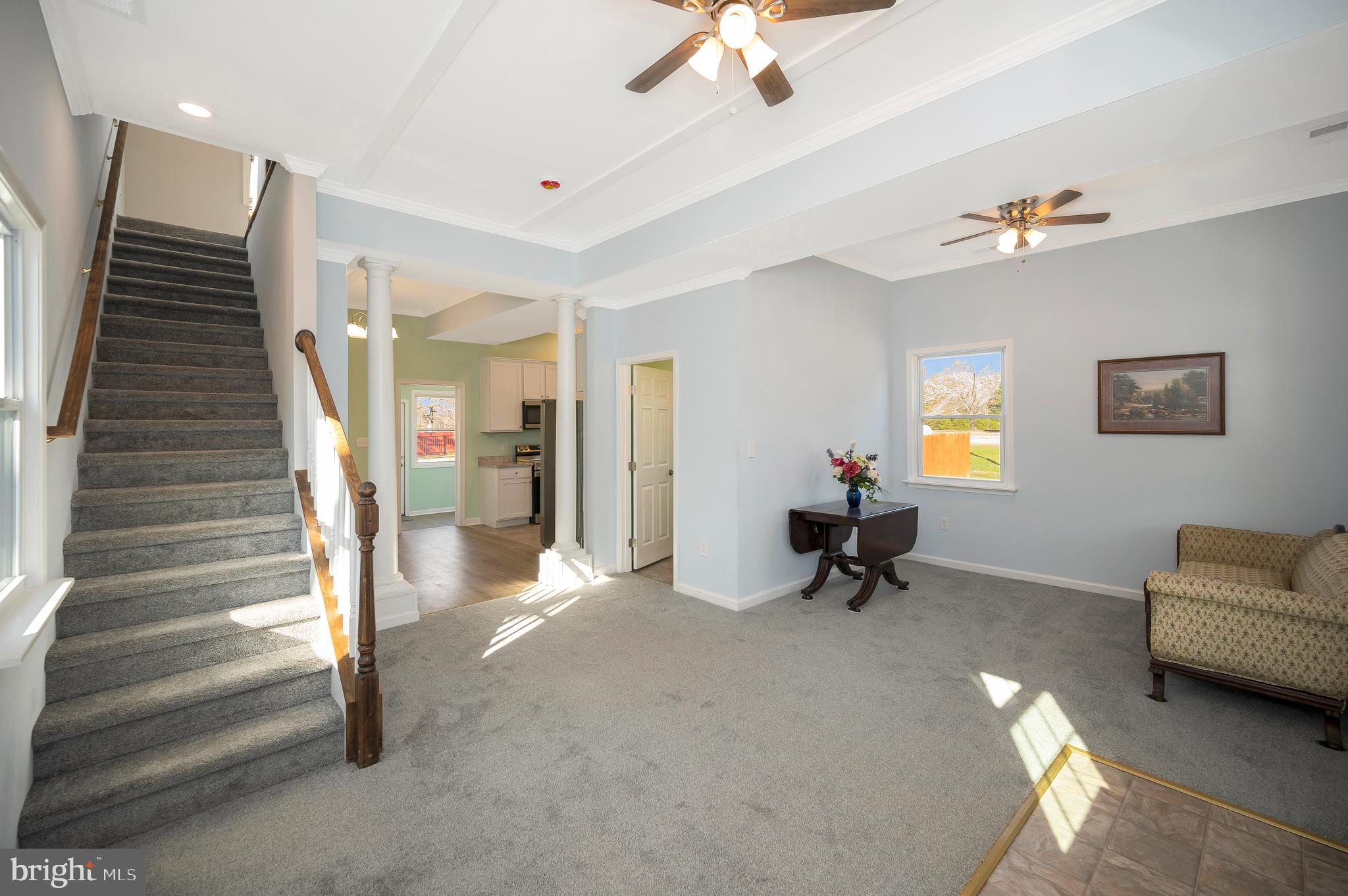 26348 Sunshine Road Ruther Glen, VA 22546 - Photo 7 of 56 a living room with furniture and a chandelier