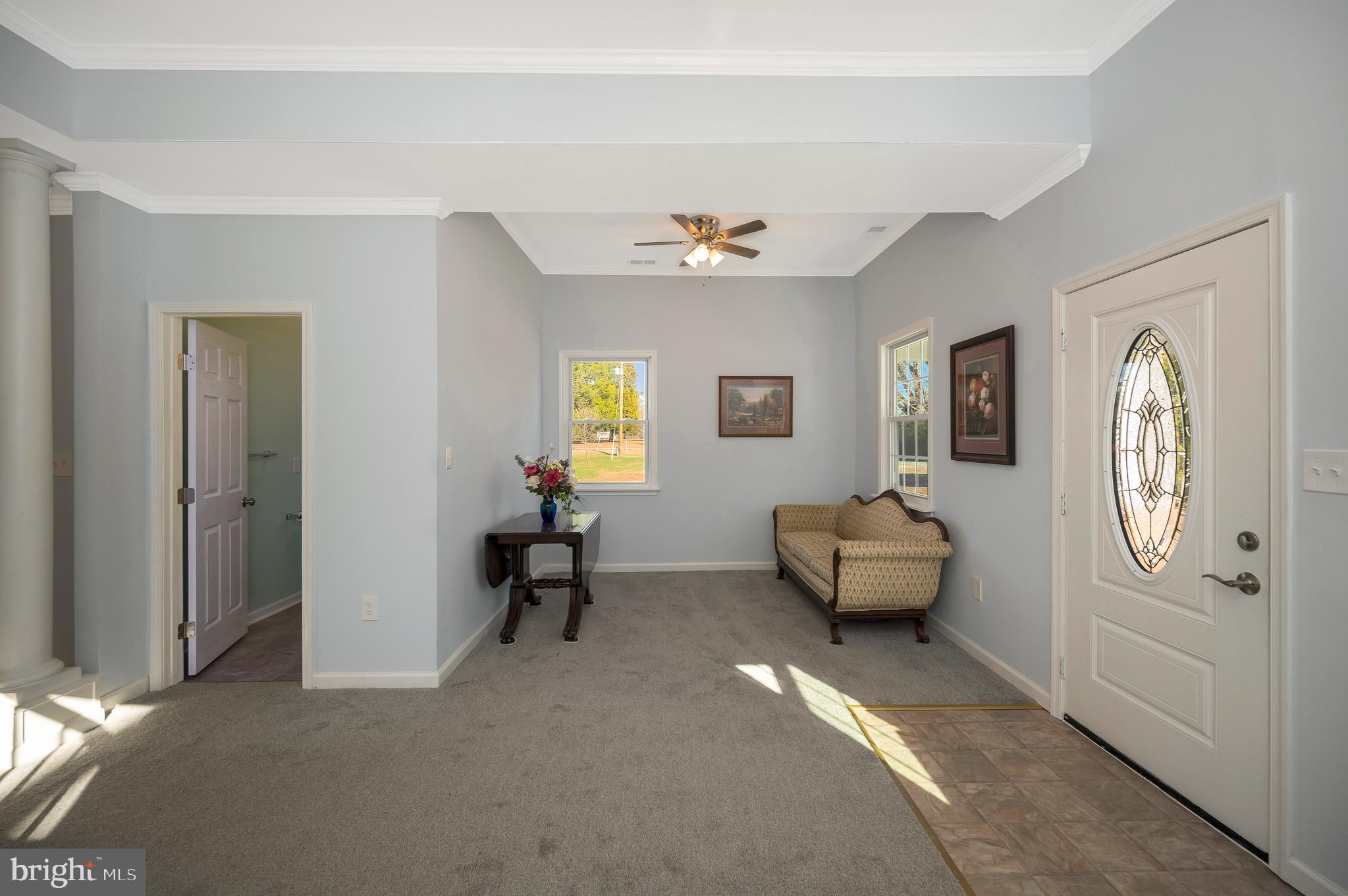 26348 Sunshine Road Ruther Glen, VA 22546 - Photo 8 of 56 a bedroom with furniture and a window