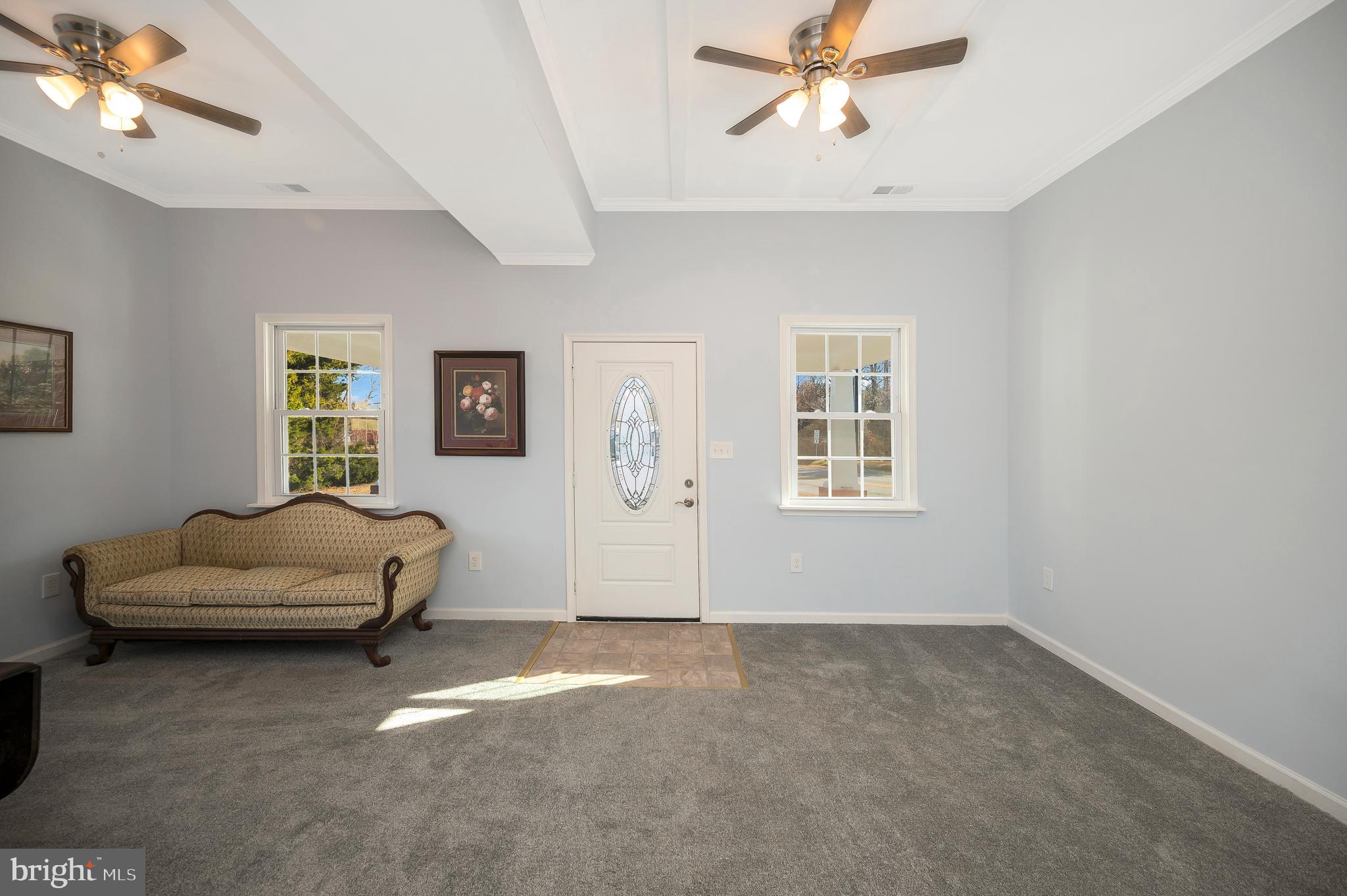 26348 Sunshine Road Ruther Glen, VA 22546 - Photo 10 of 56 a living room with furniture and a window