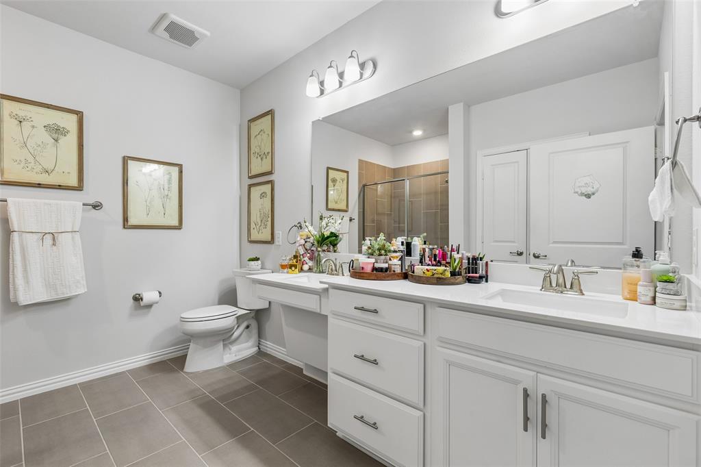 651 Watters Road, Unit 7204 Allen, TX 75013 - Photo 20 of 40 a bathroom with a toilet sink and mirror