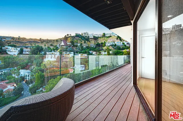 a bathroom with a sink a mirror a toilet and a shower