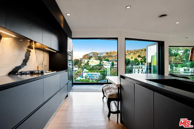a view of a living room and a floor to ceiling window