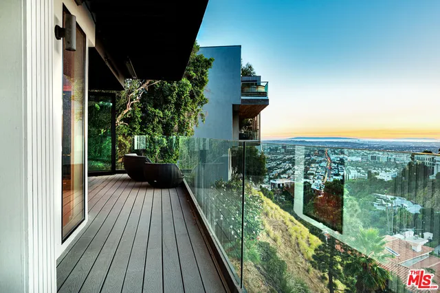 a view of balcony with furniture