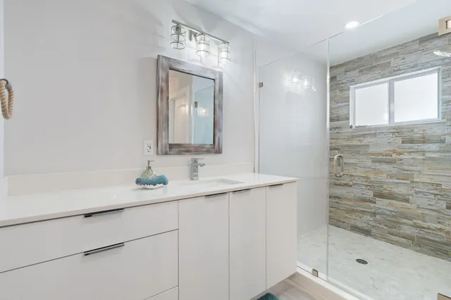 a bathroom with a sink and a mirror