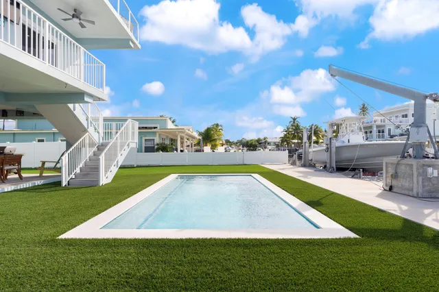 a view of yard with swimming pool