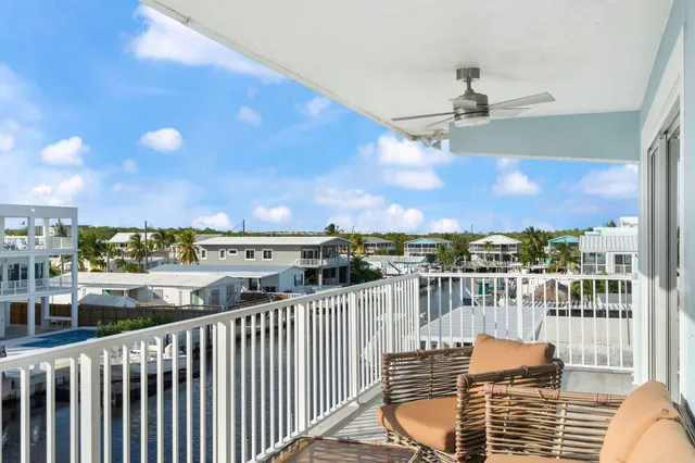 a view of a kitchen with living room and furniture