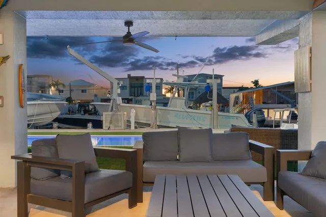 a view of a swimming pool with seating area